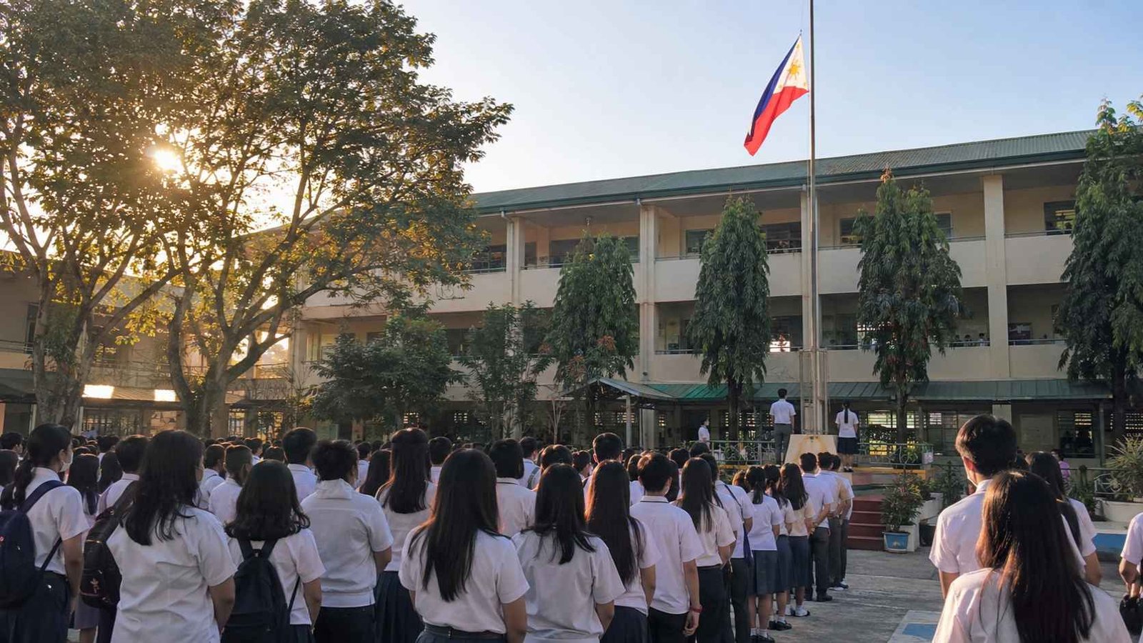 Flag Ceremony Every Monday in Philippine Schools Filipino students standing in lines during a Monday morning flag ceremony at school